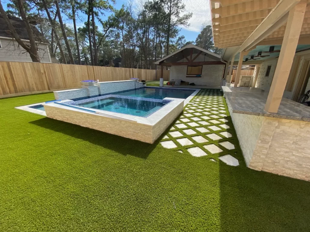 Artificial grass backyard pool area