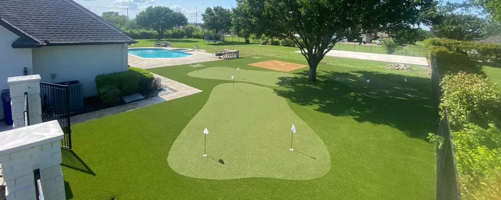 Golf green by backyard pool area