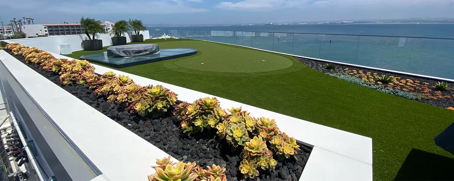 Rooftop artificial grass putting green overlooking ocean