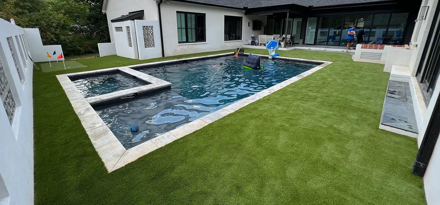 Artificial grass backyard pool area from SYNLawn