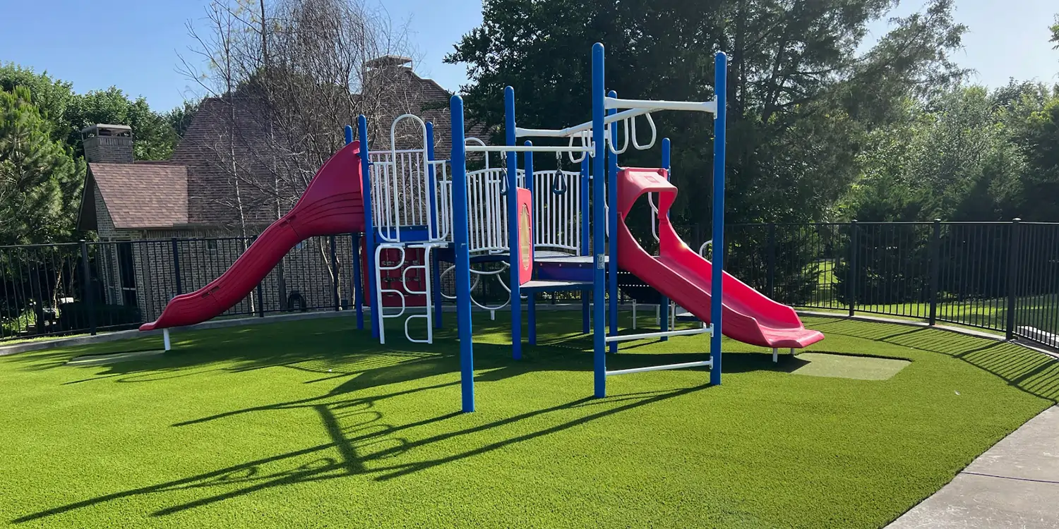 Residential playground equipment installed on artificial grass