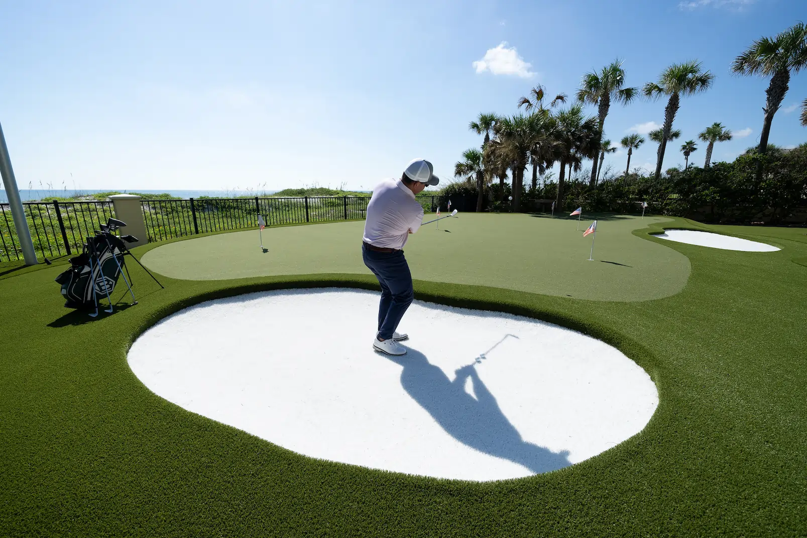 man playing golf commercial grass lawn